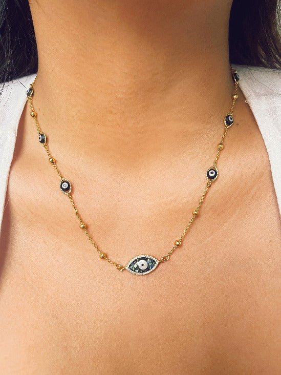 Abalone evil eye necklace handmade in the Philippines by Stoneriver. This necklace is perfect for our boho sisters! Made with hypoallergenic stainless steel chains. 17 inches in length.