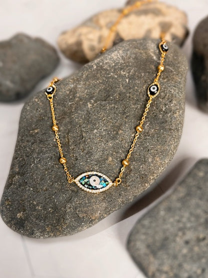 Abalone evil eye necklace handmade in the Philippines by Stoneriver. This necklace is perfect for our boho sisters! Made with hypoallergenic stainless steel chains. 17 inches in length.