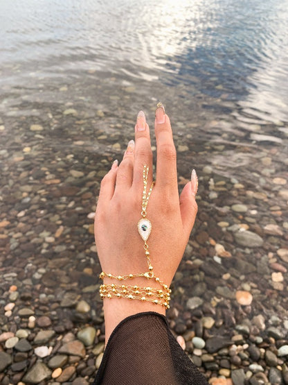 Handmade boho jewelry by Stoneriver Philippines. 10k gold filled chain with an evil eye tassel. This piece is 34 inches long and can be worn as a double layer necklace, anklet, bracelet, and as a waist chain.
