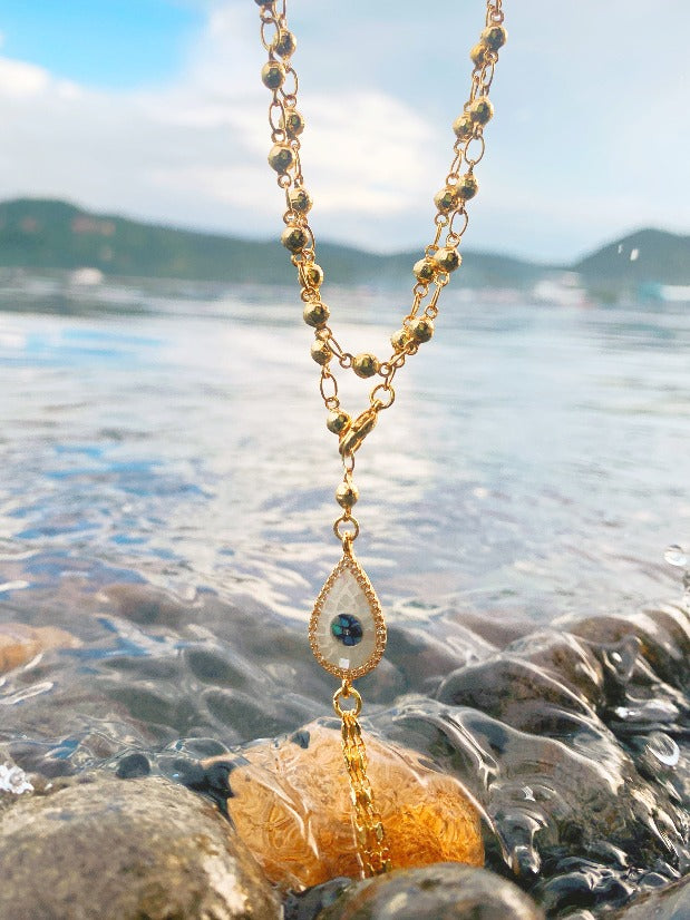 Handmade boho jewelry by Stoneriver Philippines. 10k gold filled chain with an evil eye tassel. This piece is 34 inches long and can be worn as a double layer necklace, anklet, bracelet, and as a waist chain.